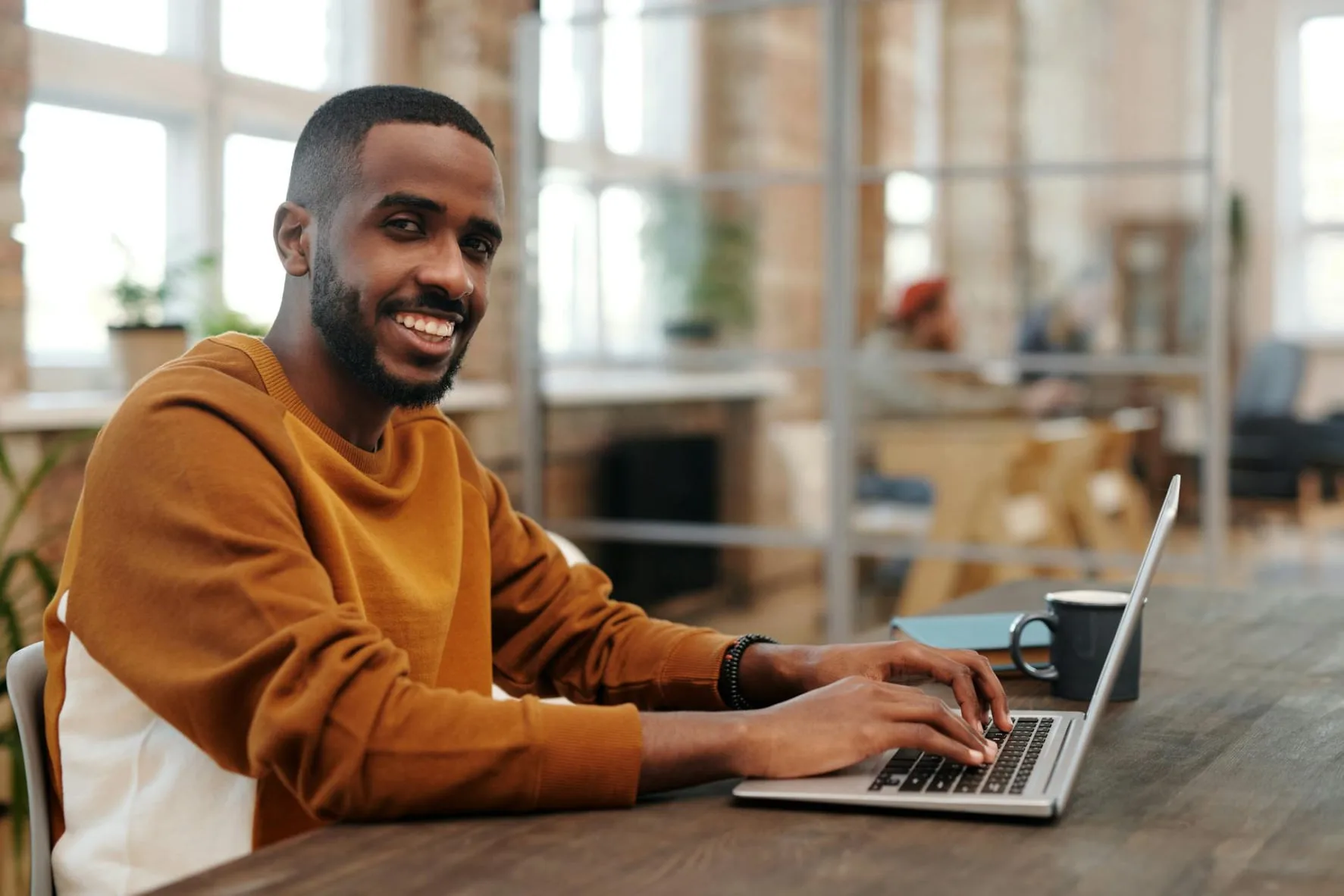 A person working late at a laptop in the evening
