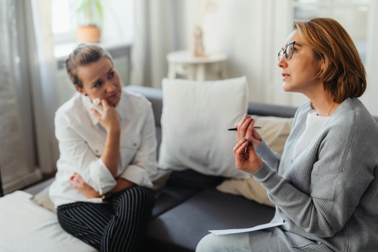 A patient in conversation with their clinician during a counseling session, representative of discussing treatment options for depression