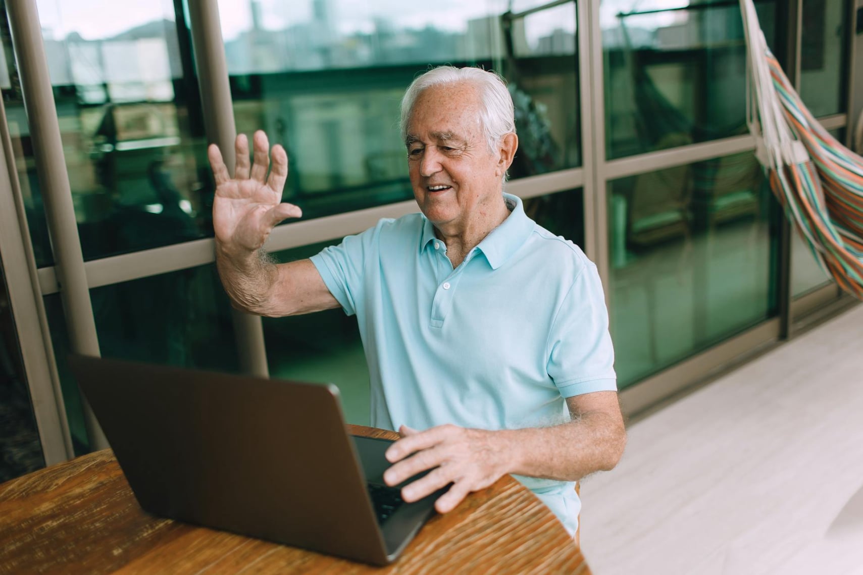 An older patient on a telehealth visit reviewing home blood-pressure readings