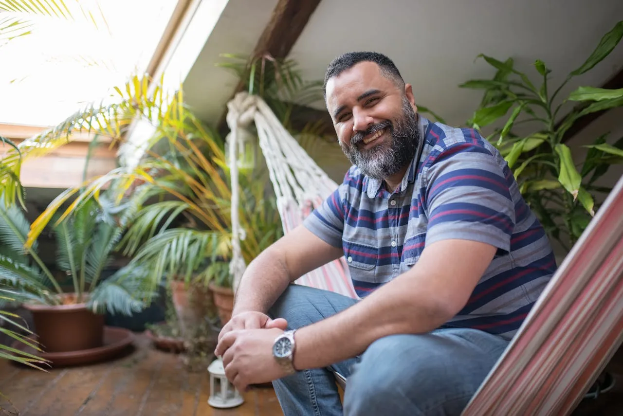 A man in his forties at home, representative of the age group most preventive screening plans are built around