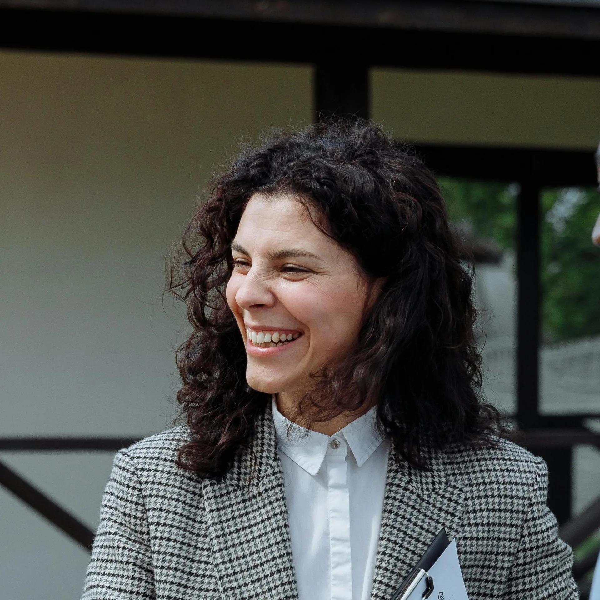 Illustrative photo of a smiling patient — not a photo of any specific reviewer below