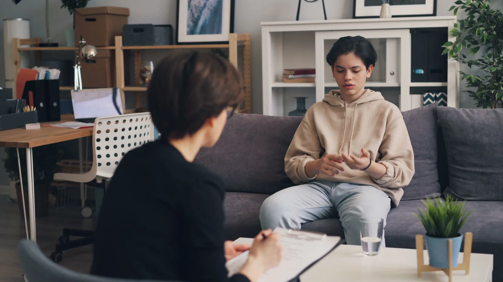 A clinician reviewing an evaluation with a patient during an in-office consultation, representative of the monitored assessment process for Spravato treatment