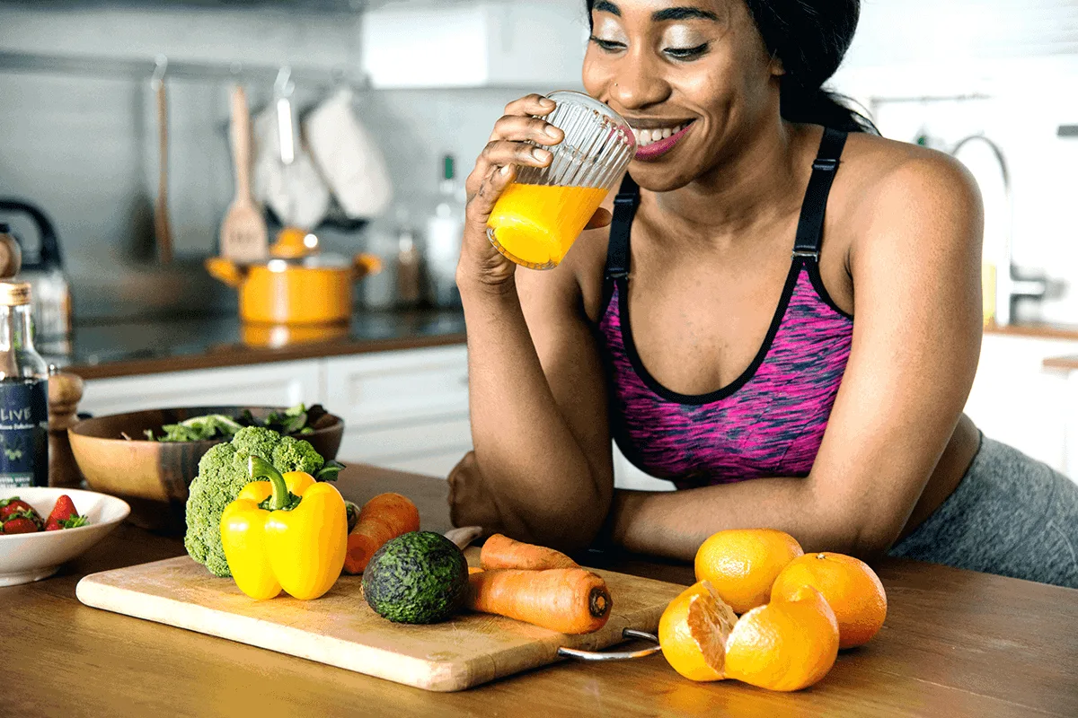 A patient enjoying fresh vegetables and juice as part of a healthy nutrition plan